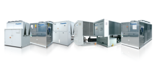 A lineup of various large industrial HVAC units with metallic and white exteriors, standing side by side on a reflective surface, isolated on a white background.
